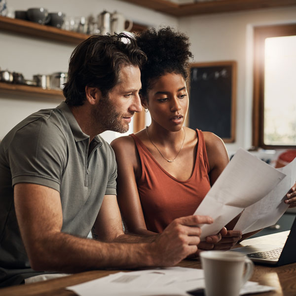 couple looking at paperwork Atlanta Oral & Facial Surgery