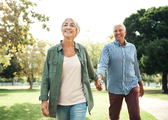 senior couple on walk Atlanta Oral & Facial Surgery