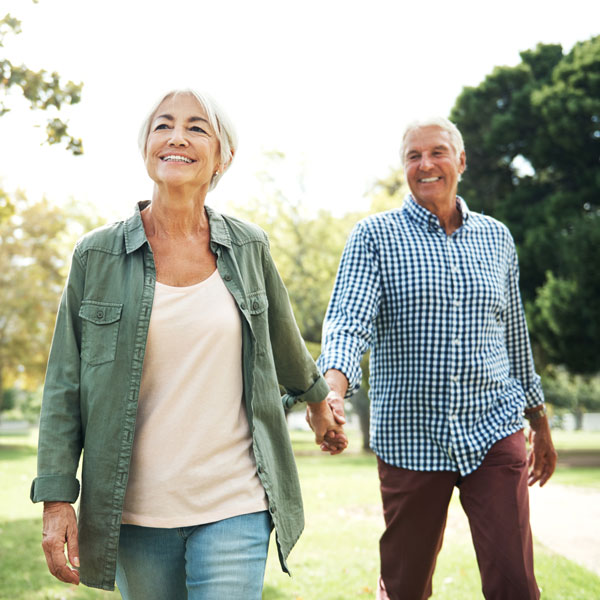 senior couple on walk Atlanta Oral & Facial Surgery