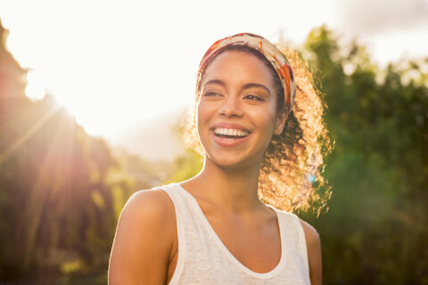 Young woman confidently smiles after implantation surgery in atlanta oral surgery,GA