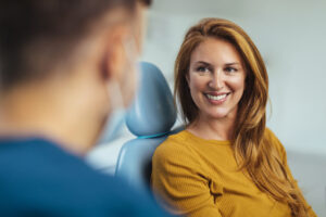 Woman listening to her dentist about bone grafting's Pros and Cons in Atlanta, GA
