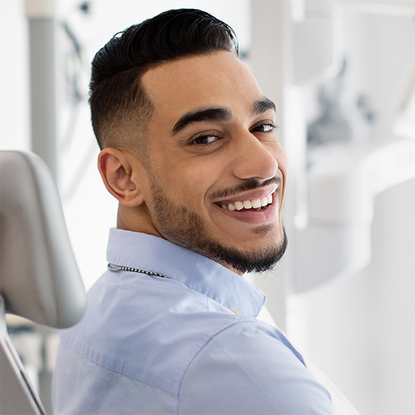 man getting her dental exam done in Atlanta, GA